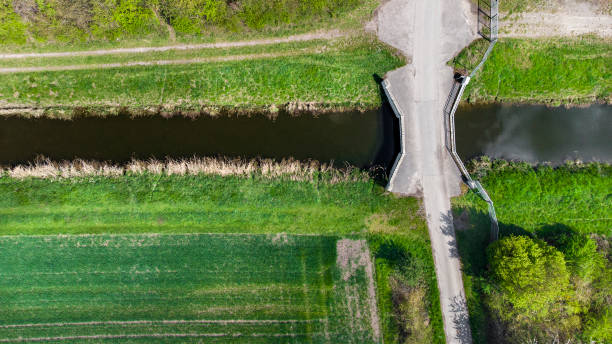 istock Concrete bridge over small creek - aerial view 1315164674