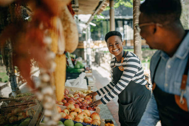istock Two african american colleagues working in the fruit and vegetable store 1315165182