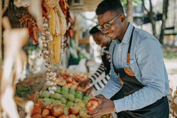 istock Two african american colleagues working in the fruit and vegetable store 1315165246