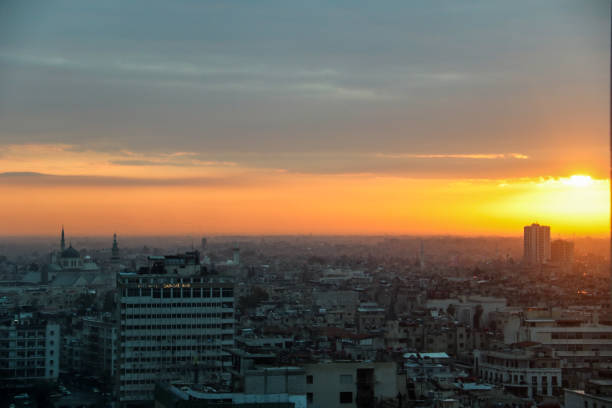 Sunrise over Damascus city in March 2020 during Putins visit Sunrise over Damascus city in March 2020 during Putins visit at sunset, images include sunrise, damascus city and military helicopters free syrian army stock pictures, royalty-free photos & images