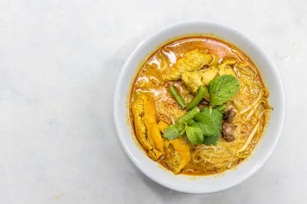 Photo of Overhead view of simple and delicious curry mee or noodle, popular cuisine in Malaysia