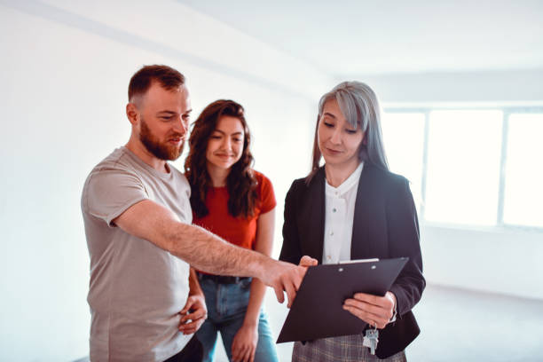 istock Male Asking Real Estate Agent About Different Apartment Properties 1315169936