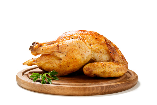 Whole roasted chicken isolated on white background