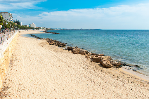 Beach and boulevard at Mazara del Vallo. Mazara del Vallo is a town with fishing harbor and a kasbah on the West coast of Sicily.