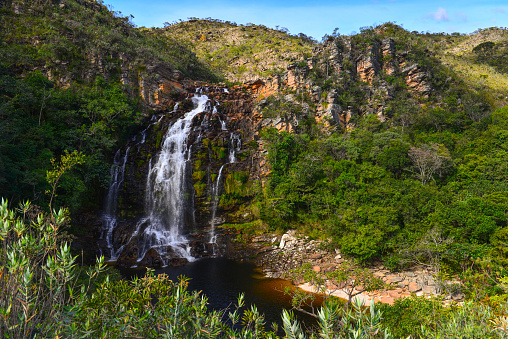 The idyllic Cachoeira da Serra Morena waterfall on the rocky landscape of Serra do Cipó range, Minas Gerais, Brazil
