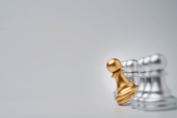 istock Golden pawn chess move out from line for different thinking and leading change , Disruption and unique concept. 1315178777