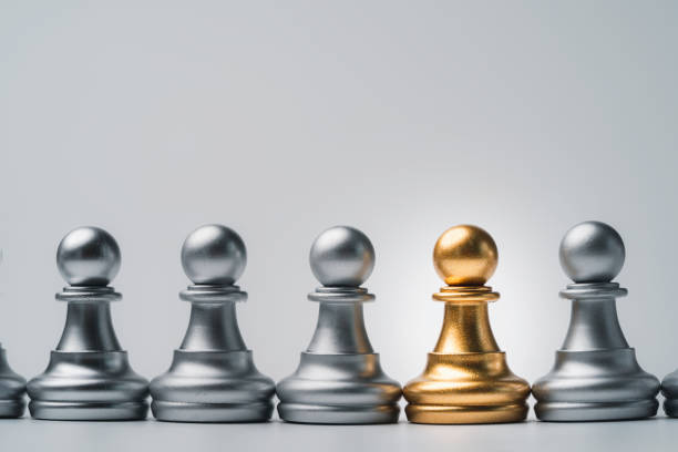 Golden pawn chess among silver for different thinking idea and disruption concept.