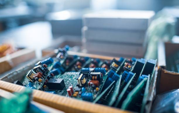 istock Close-up electric green embedded microcircuits in production 1315179436