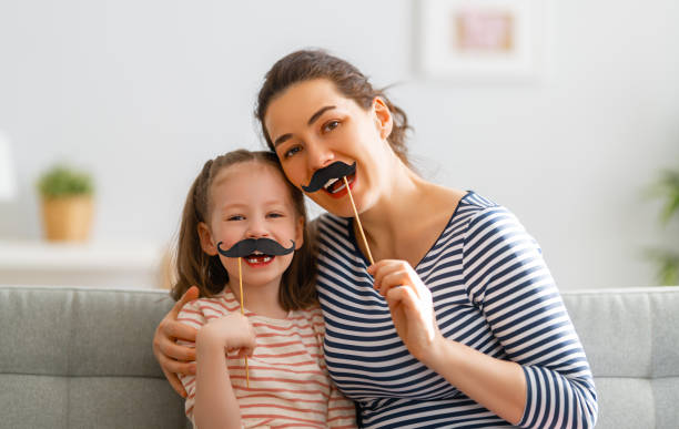 istock Mom and her daughter are playing 1315184476