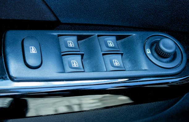 istock Buttons for adjusting the rise and fall of Windows in the car. Rear window lock button 1315190743