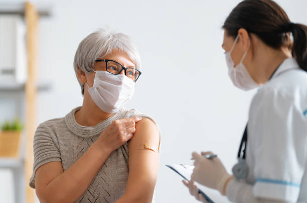 istock Senior woman after vaccination. 1315191169