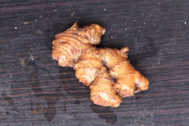istock fresh ginger isolated on black background 1315191522