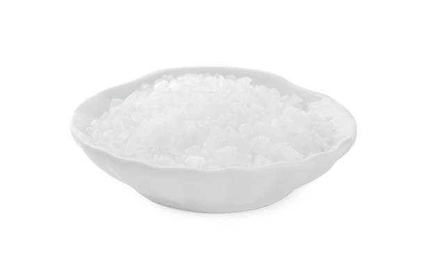 istock Plate with natural sea salt isolated on white 1315193614