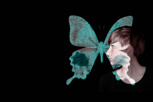 Young woman profile portrait with projected butterfly
