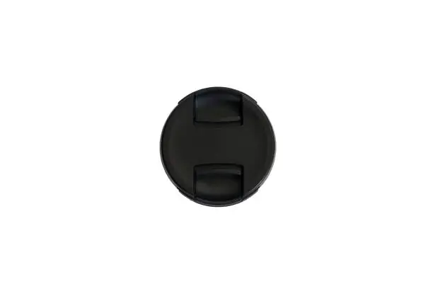 Photo of SLR camera lens cap on white isolated background