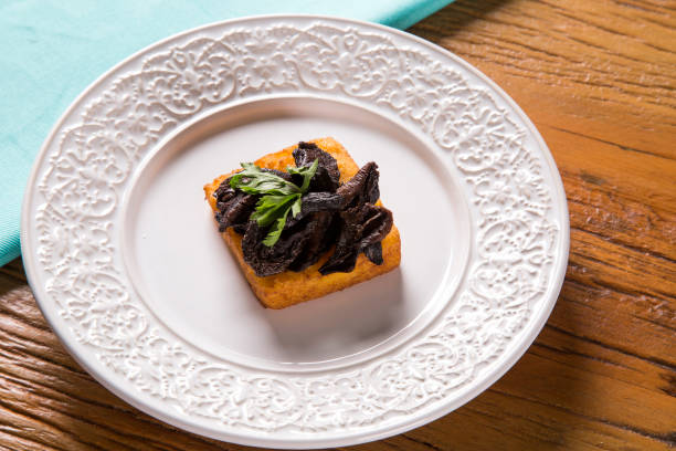 istock Traditional fried polenta with shitake 1315199546