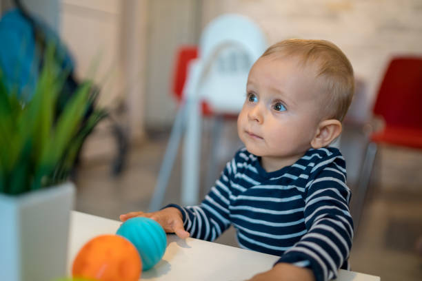 istock Happy baby playing with toy blocks 1315199779