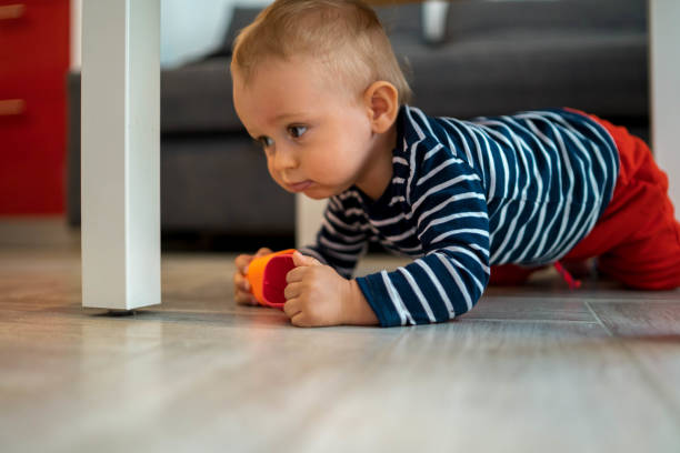 istock Happy baby playing with toy blocks 1315200300
