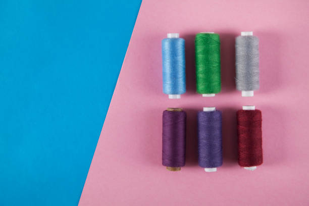 istock Colorful threads  isolated on pink and blue backgrounds. 1315201475