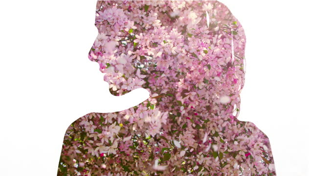 Spring freshness. Blooming cherry tree closed in shape of seductive woman. Double exposure.