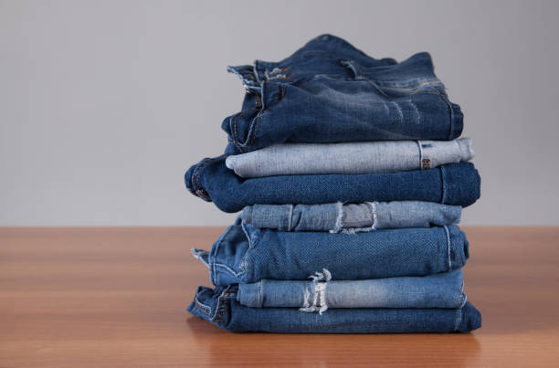 istock Fashion different jeans on wooden background. 1315202233