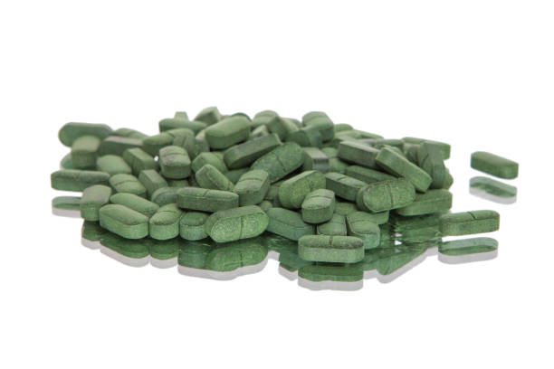 istock Green tablets on white background, Isolated, on white, 1315202468