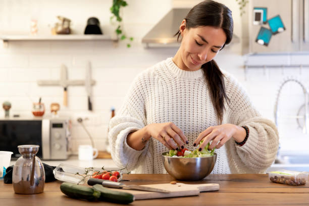 istock Young Women Preparing Salad 1315205302