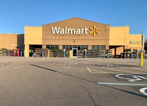 Pittsburgh, USA     April 26, 2021\nWalmart store in Gibsonia, a suburb of Pittsburgh.   Thus Walmart has a large display of plants for sale in front of store.