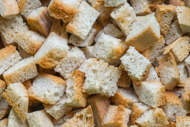 istock Top view on crispy bread cubes. Pile of croutons from white bread 1315209986