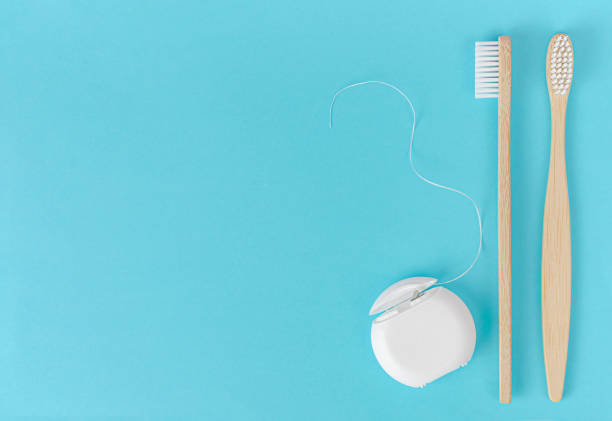 istock Bamboo toothbrush and dental floss 1315210656