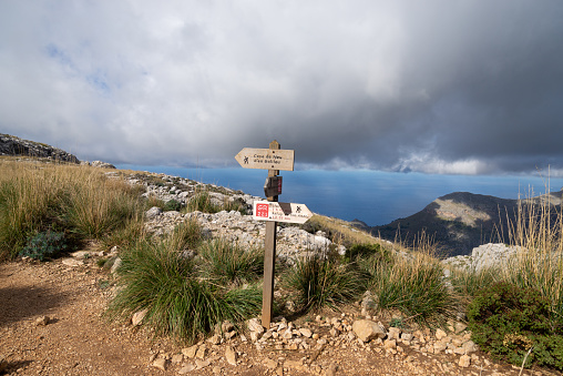 Wooden sign post in the Sierra de Tramuntana on balearic island Mallorca. Spain, November 2016