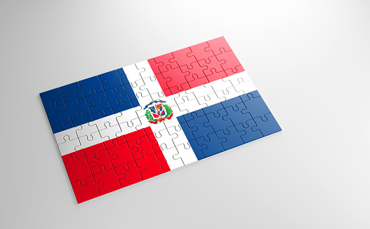 A jigsaw puzzle with a print of the flag of Dominican Republic, pieces of the puzzle isolated on white background. Fulfillment and perfection concept. Symbol of national integrity. 3D illustration.
