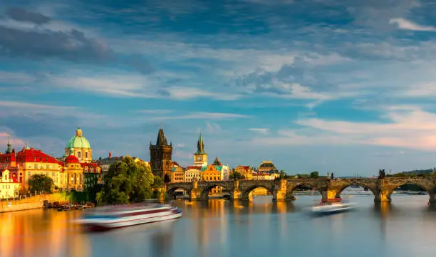 Photo of Charles Bridge in Prague in Czechia. Prague, Czech Republic. Charles Bridge (Karluv Most) and Old Town Tower. Vltava River and Charles Bridge. Concept of world travel, sightseeing and tourism.