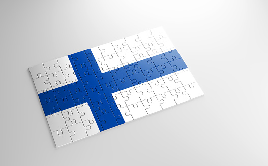 A jigsaw puzzle with a print of the flag of Finland, pieces of the puzzle isolated on white background. Fulfillment and perfection concept. Symbol of national integrity. 3D illustration.