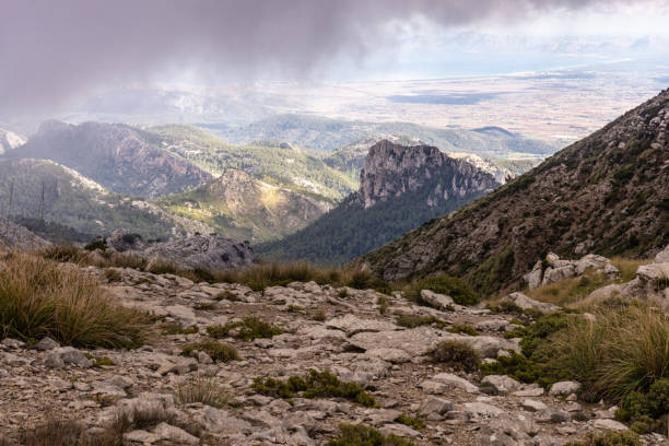 istock Low clouds drifting over mountain range on balearic island Mallorca 1315213765