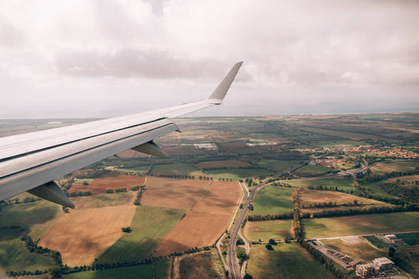 istock View from the airplane window of the fields and greenery below 1315215075