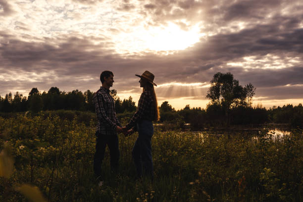 istock Loving couple in the field. Sunset, silouette. 1315216340