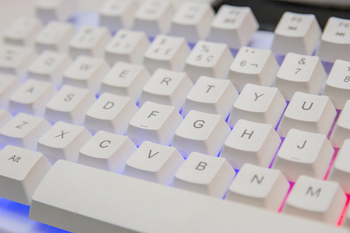white gamer keyboard with colorful lights in rio de janeiro brazil.