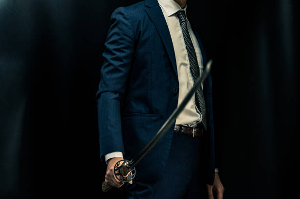 istock A man wearing suits and holding japanese sword 1315218160