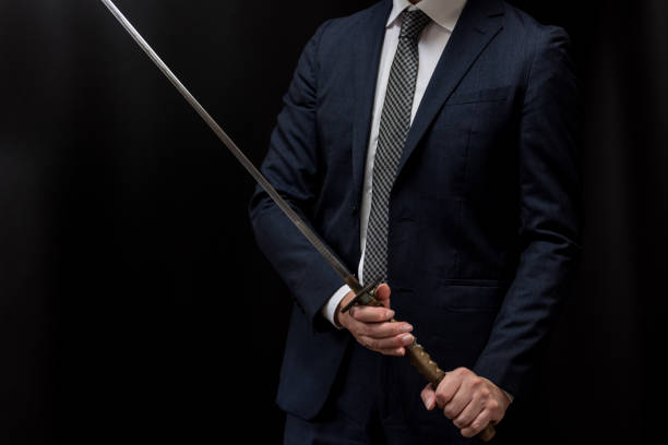 istock A man wearing suits and holding japanese sword 1315218173
