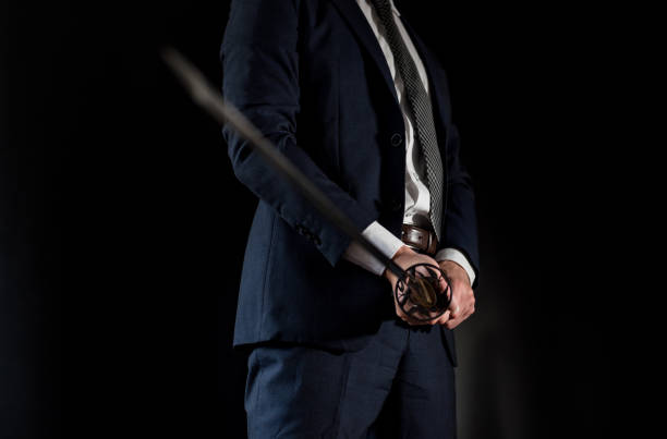 istock A man wearing suits and holding japanese sword 1315218271