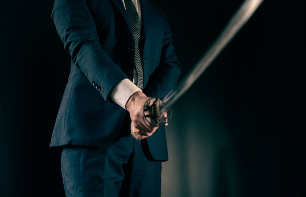 istock A man wearing suits and holding japanese sword 1315218417