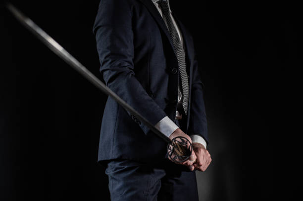istock A man wearing suits and holding japanese sword 1315218968
