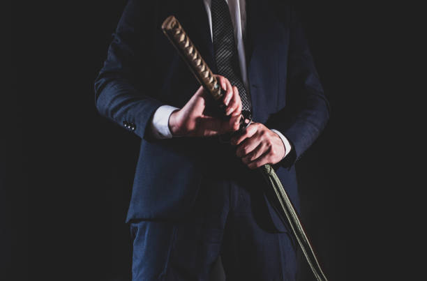 istock A man wearing suits and holding japanese sword 1315218974