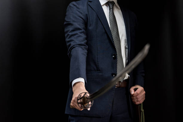 istock A man wearing suits and holding japanese sword 1315218981