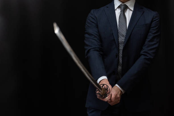 istock A man wearing suits and holding japanese sword 1315219063