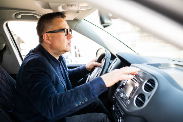 istock Middle age mature Man pressing red triangle car hazard warning button 1315220490