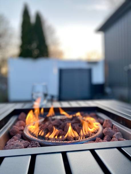 istock Gas Fire Pit Flames on Patio at Sunset 1315223347