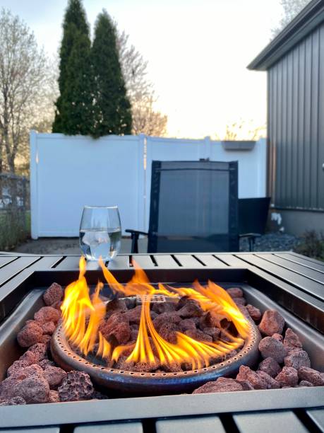 istock Gas Fire Pit Flames on Patio at Sunset 1315223348