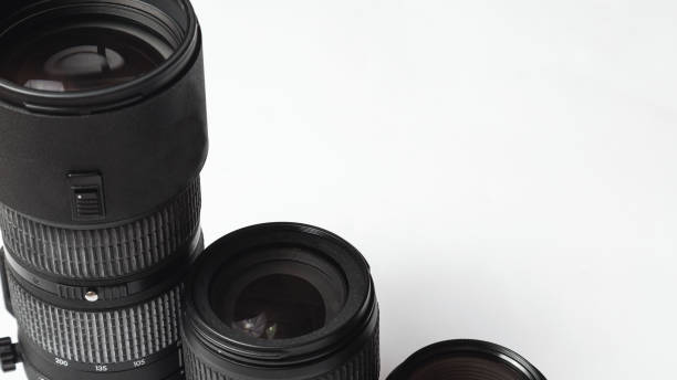 istock camera lenses. photographer's equipment. copy space. White background 1315224329